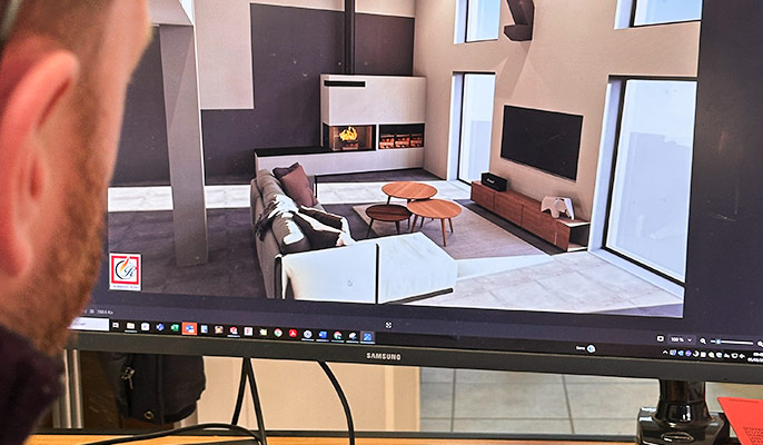 Bureau d'étude Bastien Masson étudiant les plans pour insérer une cheminée